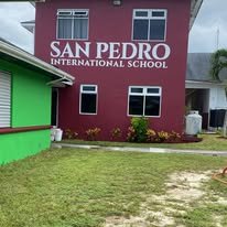 San Pedro International School exterior, AC units installed across the building